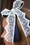 Nativity Lace layered with stardust dark navy satin bow