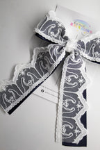 Nativity Lace layered with stardust dark navy satin bow